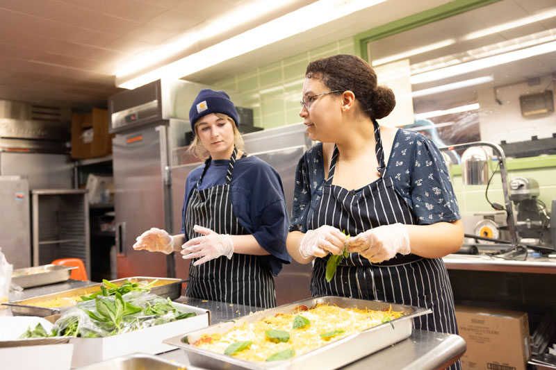 NIU students working on food prep with Edible Campus program